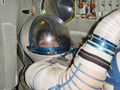 Wearing Sokol pressurized suit
(inside the Soyuz re-entry module simulator)