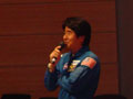 Astronaut Doi giving lecture.