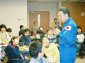 Astronaut Furukawa answering the questions from the children.