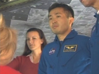 Astronaut Wakata checking Discovery （Image credit: NASA）