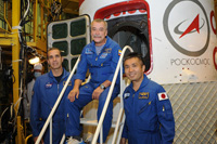 Wakata and other backup crew members pose for a commemorative photo in front of the actual Soyuz spacecraft (Credit: S.P.Korolev RSC Energia)