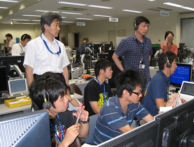 Professor Nishino (back left) and his project team members monitoring the experiment to start at the User Operations Area (UOA)