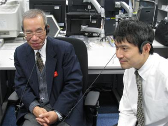 Co-Investigators Sugimura (Professor of the Kyoto Institute of Technology) and Nagaoka (Assitant Professor of the Kyoto Institute of Technology) monitoring the experiment at the User Operations Area (UOA), TKSC