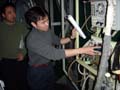 Astronaut Hoshide manipulating the training equipment