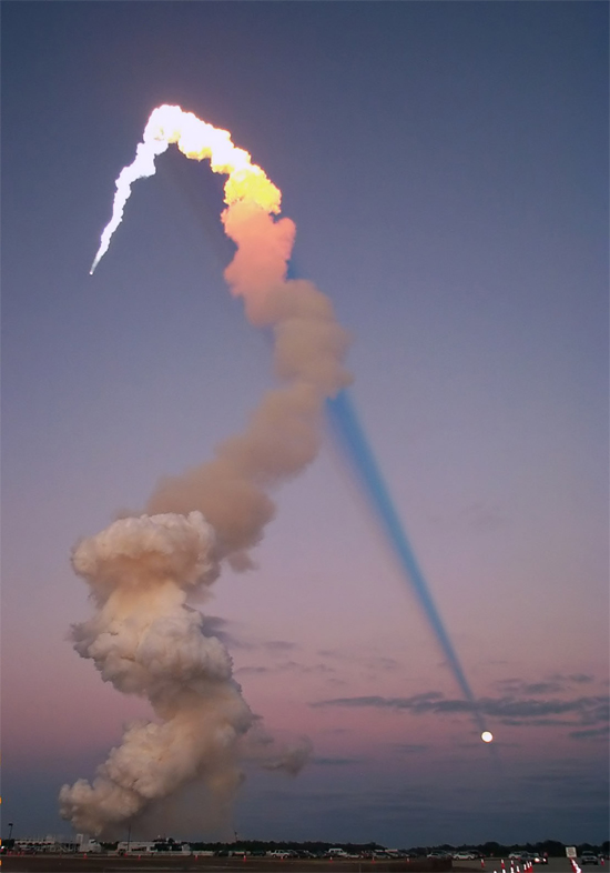Shuttle Plume Shadow Points to the Moon